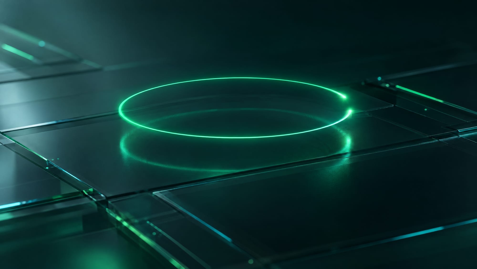 A ring of green light, almost closed, hovering over dark glass