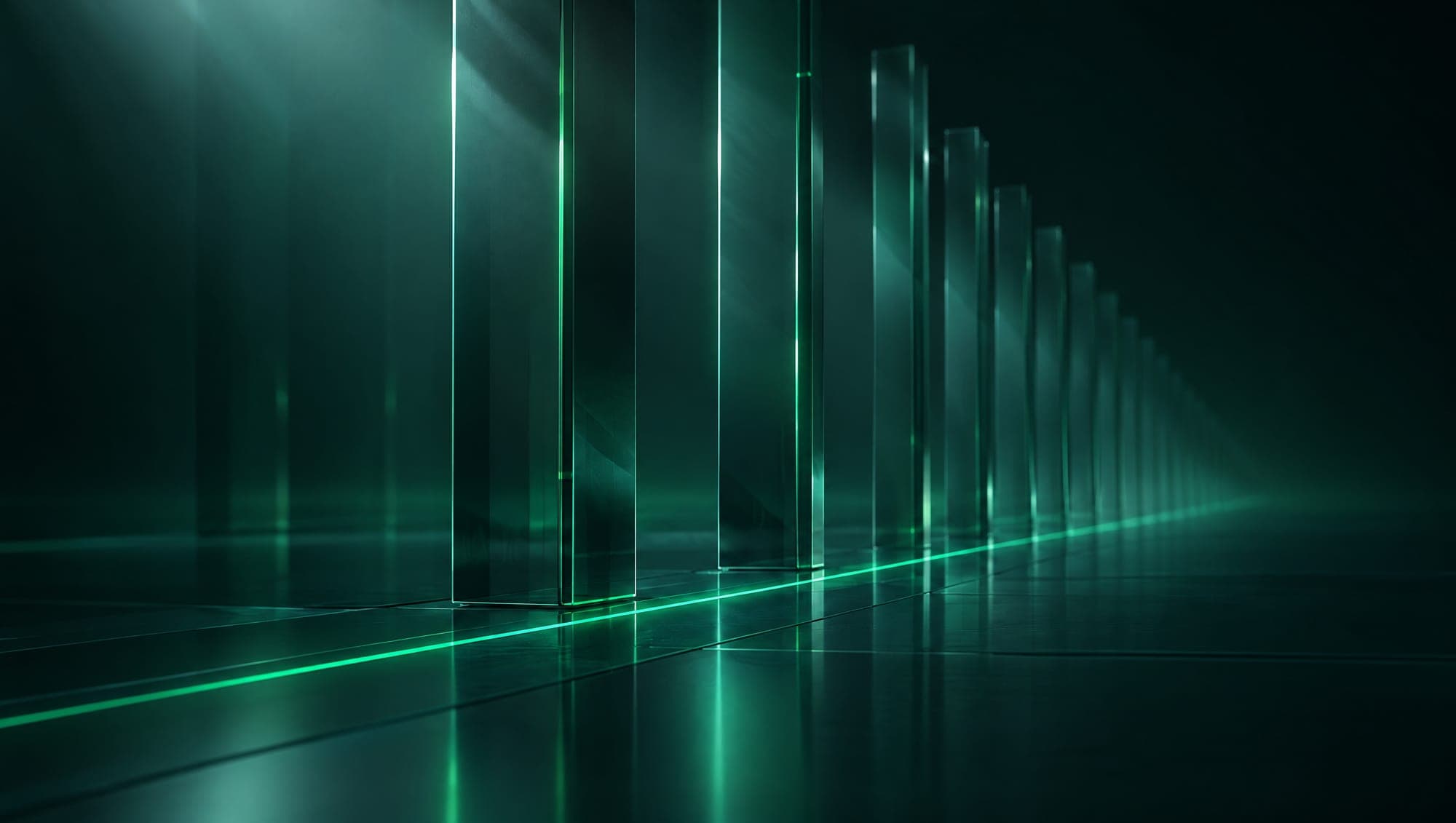 A colonnade of tall glass pillars with a line of green light along the floor