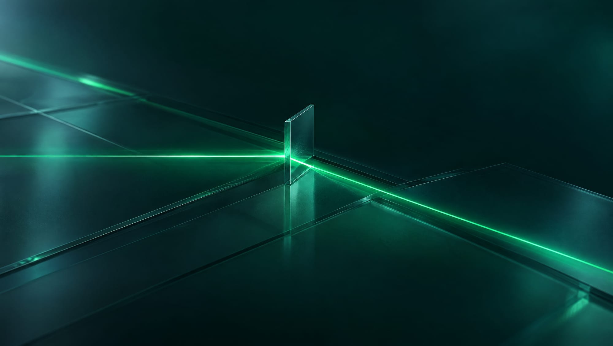 A line of green light split in two by a thin glass blade